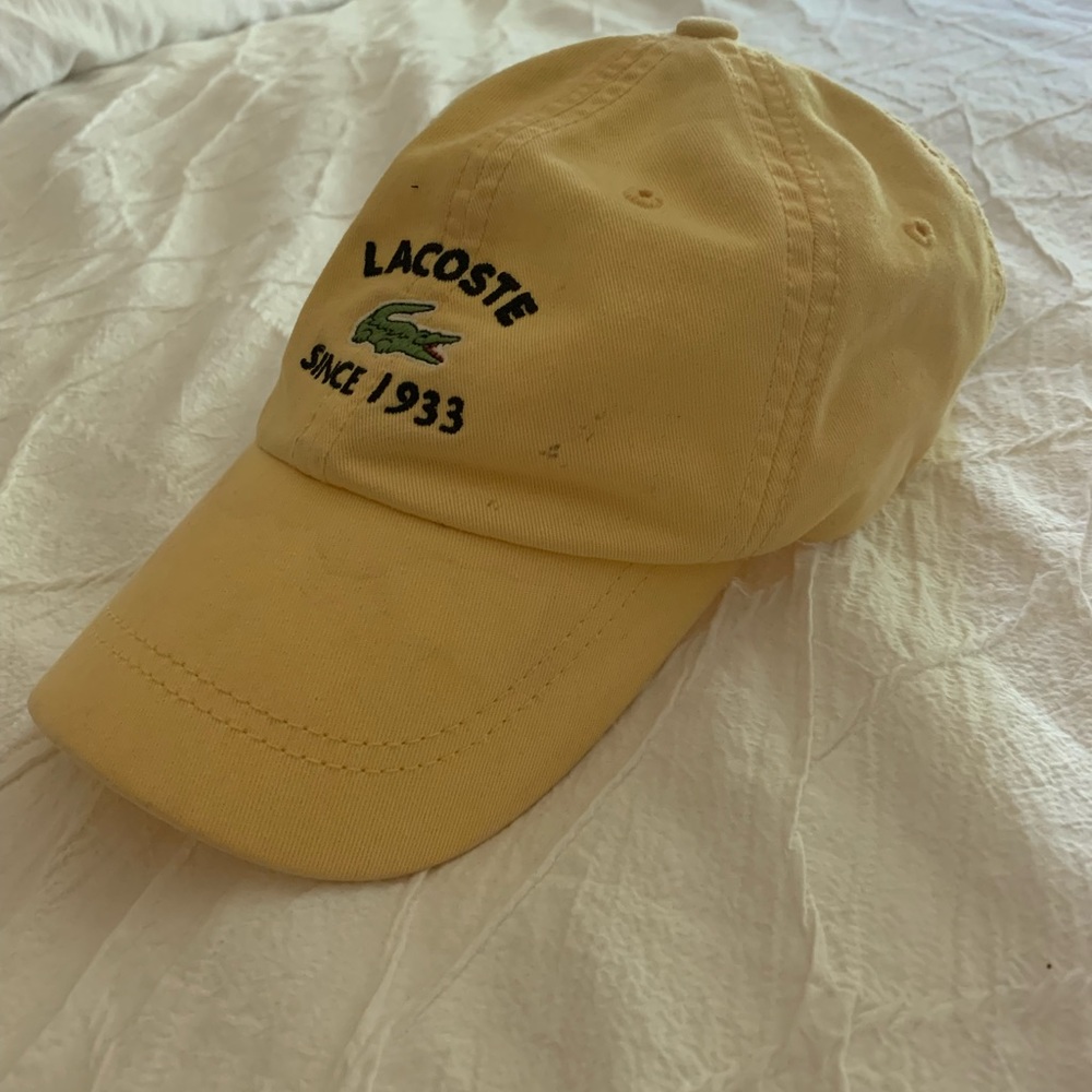 LACOSTE Baseball Cap.  Yellow with black lettering.